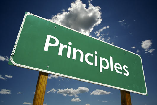 Principles sign on green background